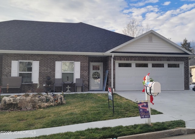 view of front of home featuring a front lawn and a garage