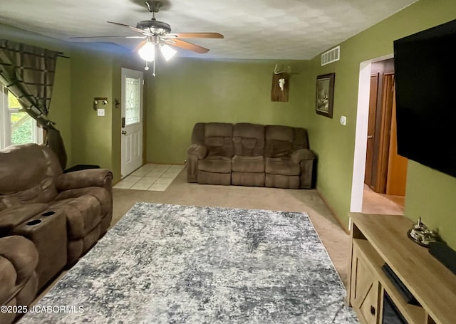 909 E Jefferson St, Linn, MO 65051 - living room with light carpet and ceiling fan