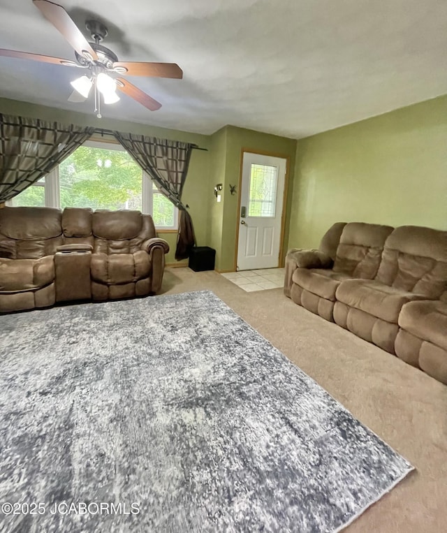 909 E Jefferson St, Linn, MO 65051 - carpeted living room with ceiling fan