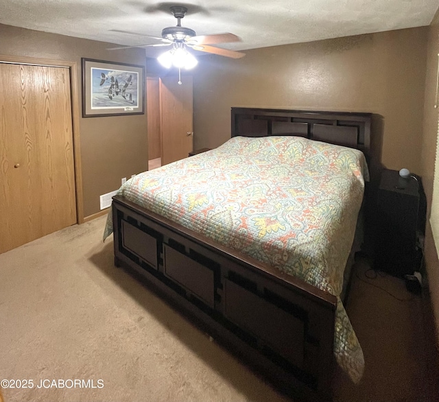 909 E Jefferson St, Linn, MO 65051 - bedroom with carpet floors, a closet, and a ceiling fan