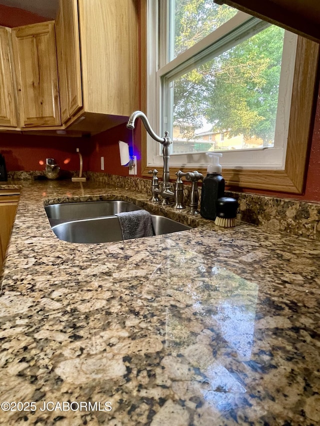909 E Jefferson St, Linn, MO 65051 - kitchen featuring a sink and dark stone counters