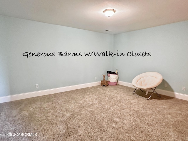 interior space featuring carpet and baseboards