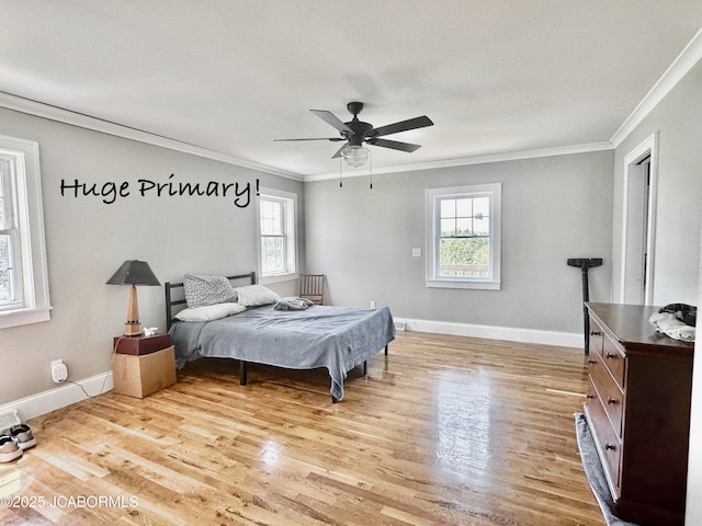 bedroom featuring light wood-style flooring, baseboards, and ornamental molding