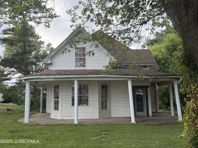 231 Elm Ave, New Bloomfield, MO 65063 - farmhouse with a porch, a front yard, and a shingled roof