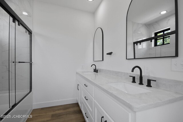 5306 Tebbetts View Dr, Tebbetts, MO 65080 - full bath with double vanity, wood finished floors, recessed lighting, and combined bath / shower with glass door