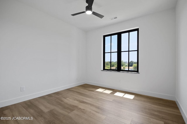 5306 Tebbetts View Dr, Tebbetts, MO 65080 - spare room with wood finished floors and ceiling fan