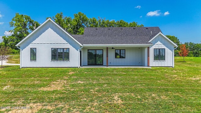 5306 Tebbetts View Dr, Tebbetts, MO 65080 - rear view of house featuring a patio area, a lawn, and a shingled roof