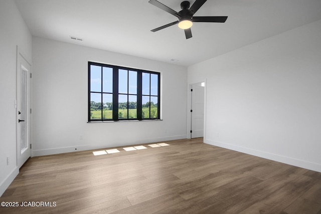 5306 Tebbetts View Dr, Tebbetts, MO 65080 - empty room with a ceiling fan and wood finished floors