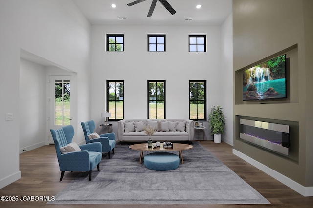 5306 Tebbetts View Dr, Tebbetts, MO 65080 - living area featuring a ceiling fan, a towering ceiling, healthy amount of natural light, dark wood-style floors, and recessed lighting