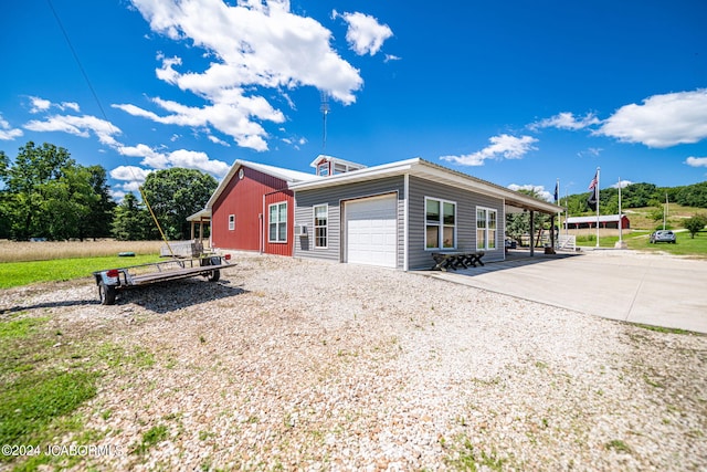 view of side of property with a garage