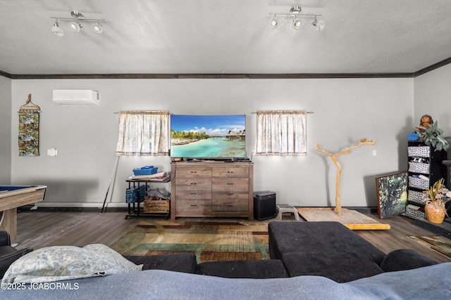 6733 Rocking Horse Ln, Fulton, MO 65251 - living area featuring a wall mounted AC, wood finished floors, crown molding, baseboards, and a textured ceiling