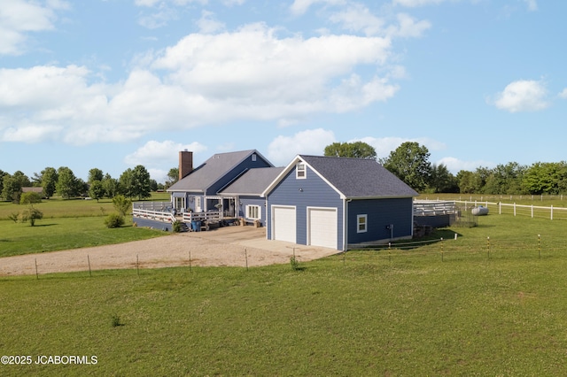 6733 Rocking Horse Ln, Fulton, MO 65251 - rear view of house with concrete driveway, a chimney, and an attached garage