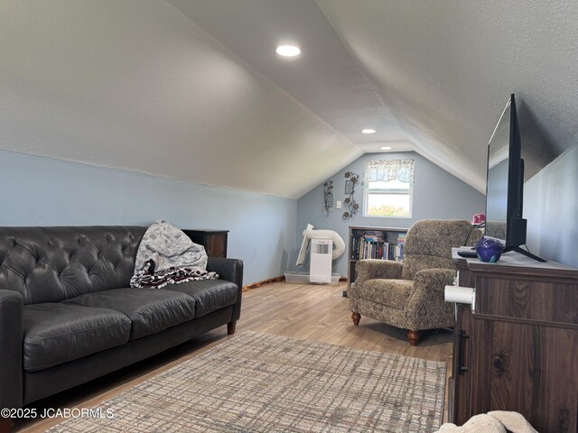 6733 Rocking Horse Ln, Fulton, MO 65251 - living area with vaulted ceiling, wood finished floors, and baseboards