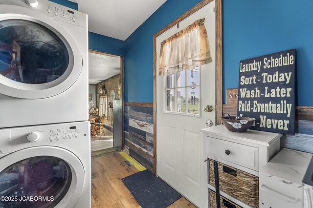 6733 Rocking Horse Ln, Fulton, MO 65251 - washroom featuring stacked washing machine and dryer and light wood finished floors