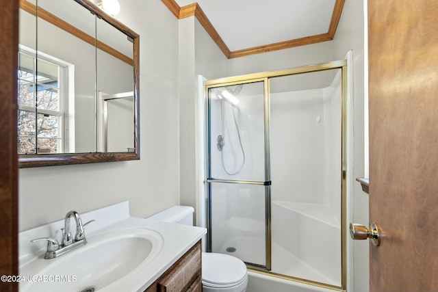 bathroom featuring ornamental molding, vanity, a shower with shower door, and toilet