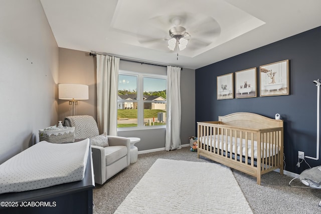 1330 Summerfield Dr, Jefferson City, MO 65109 - bedroom with carpet floors, a tray ceiling, a ceiling fan, and a crib