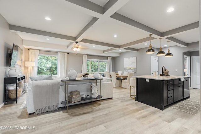 1330 Summerfield Dr, Jefferson City, MO 65109 - kitchen featuring open floor plan, dark cabinetry, light wood finished floors, coffered ceiling, and beam ceiling