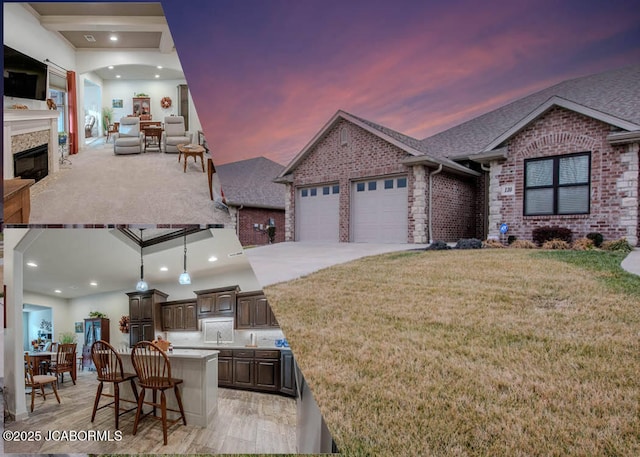 exterior space with a garage, area for grilling, a yard, and a fireplace