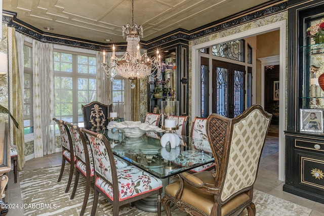 dining space featuring ornamental molding and a notable chandelier