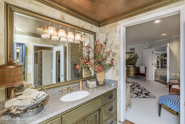 bathroom featuring vanity and ornamental molding