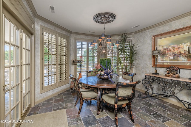 dining area featuring a chandelier and ornamental molding