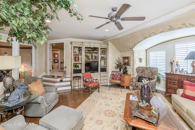 living room with crown molding, hardwood / wood-style floors, and ceiling fan