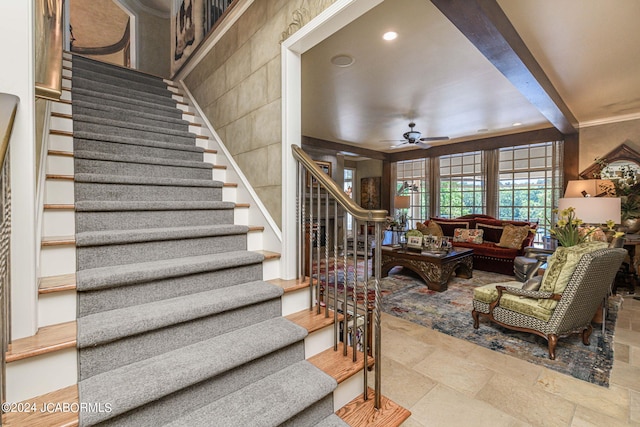 interior space with ceiling fan