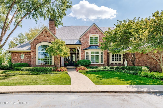 tudor house with a front lawn