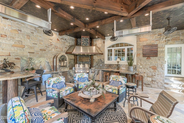 dining area featuring beam ceiling