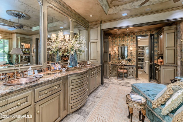 bathroom featuring vanity, ceiling fan, and crown molding