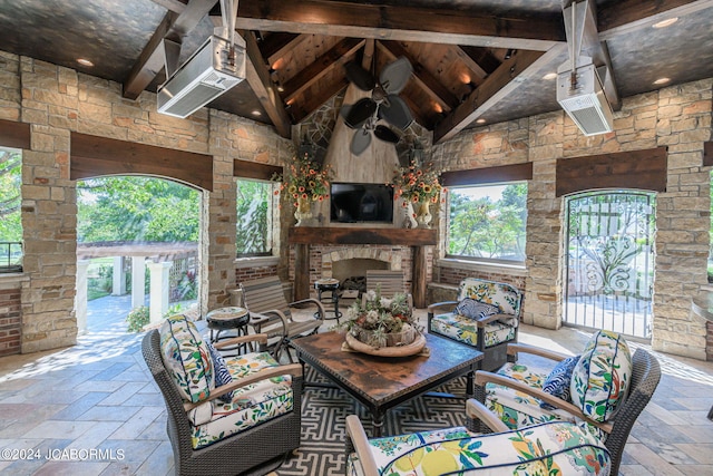 view of patio with an outdoor living space with a fireplace