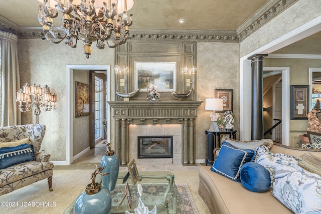 living room featuring light carpet, decorative columns, ornamental molding, a notable chandelier, and a fireplace