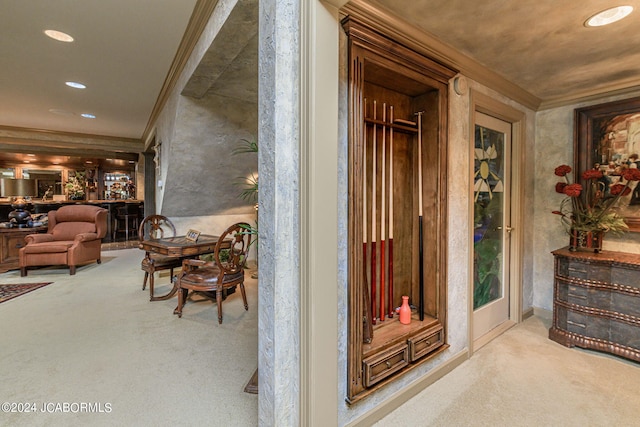 corridor with light carpet and crown molding