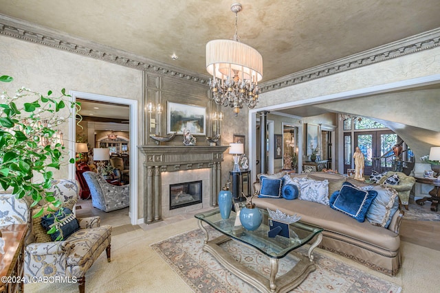 living room with a fireplace, an inviting chandelier, and ornamental molding