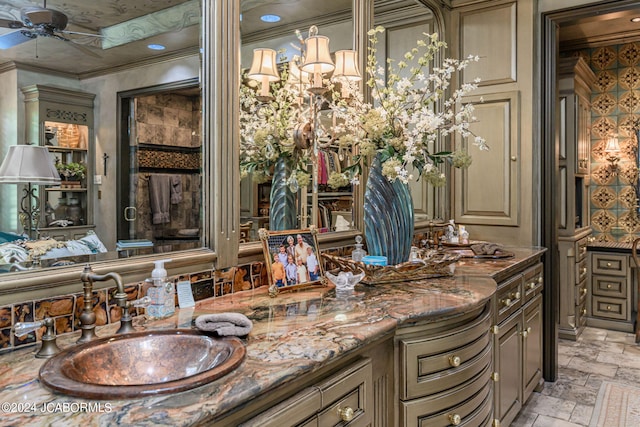 bathroom featuring vanity, ceiling fan, and ornamental molding