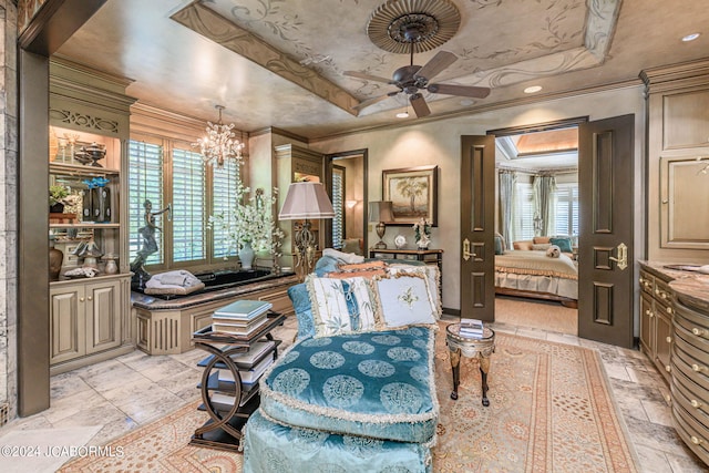 sitting room with ceiling fan with notable chandelier, a raised ceiling, and crown molding