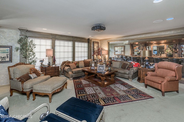 carpeted living room with ornamental molding