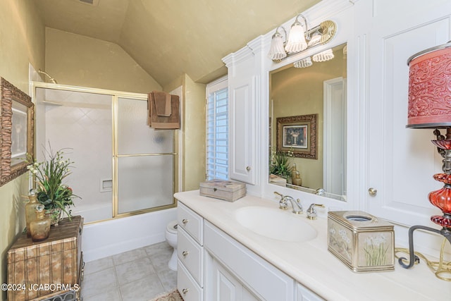 full bathroom featuring vanity, vaulted ceiling, enclosed tub / shower combo, tile patterned flooring, and toilet