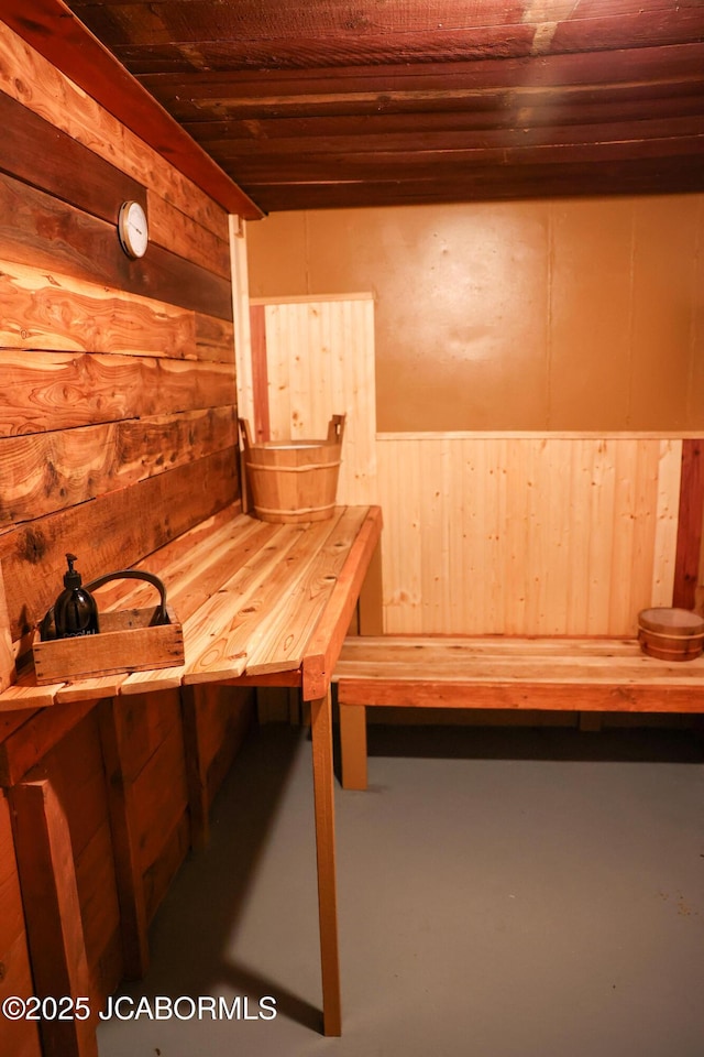 view of sauna featuring concrete floors