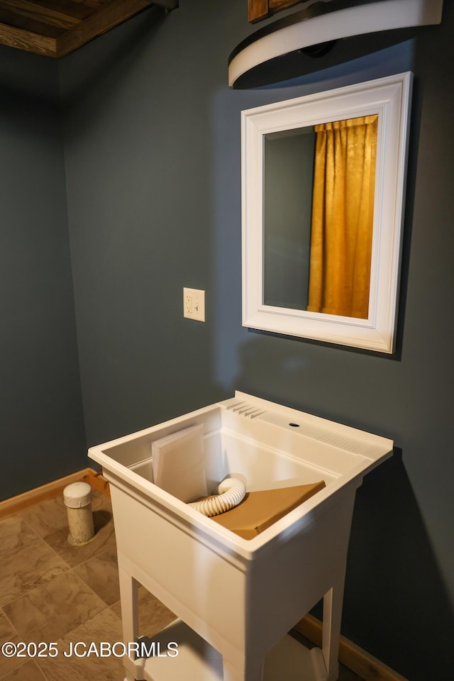 bathroom featuring baseboards and marble finish floor
