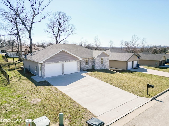 ranch-style house featuring driveway, a front yard, a garage, and fence