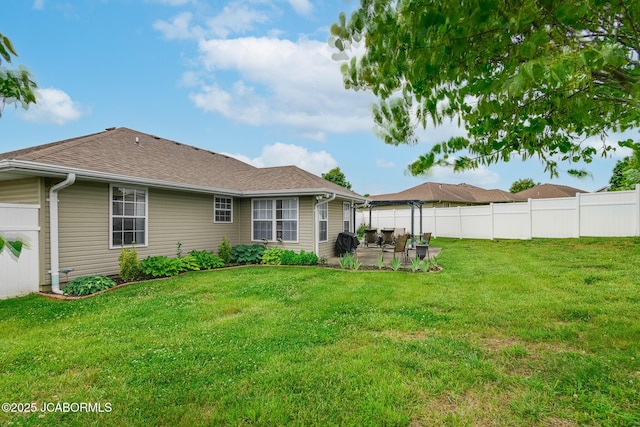 180 Venus St, Holts Summit, MO 65043 - back of house featuring a patio area and roof with shingles