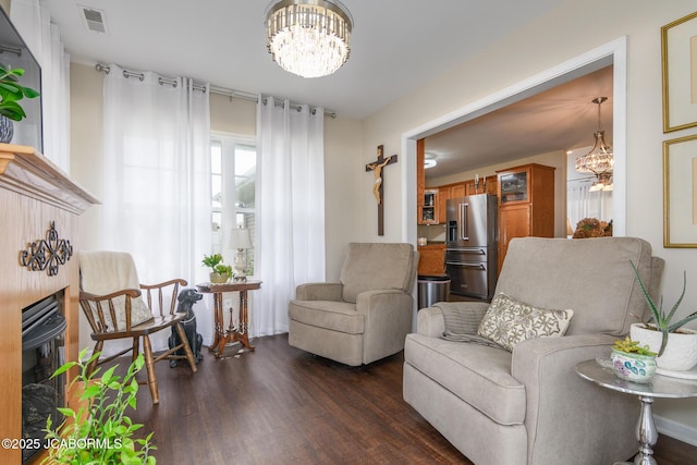 180 Venus St, Holts Summit, MO 65043 - sitting room with a chandelier and dark wood-style flooring