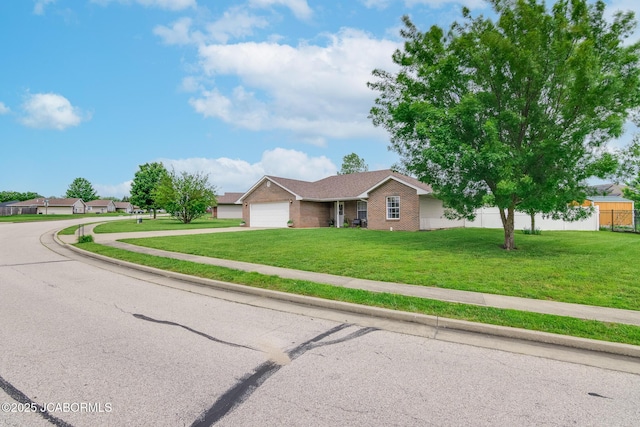 180 Venus St, Holts Summit, MO 65043 - ranch-style home with concrete driveway, brick siding, and a garage