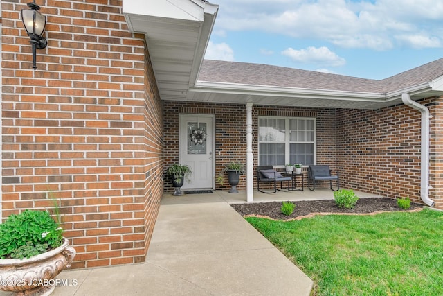 180 Venus St, Holts Summit, MO 65043 - property entrance with brick siding and roof with shingles
