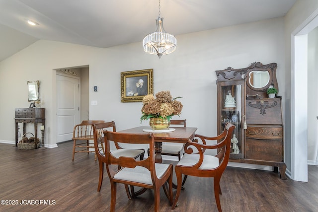 180 Venus St, Holts Summit, MO 65043 - dining room featuring dark wood finished floors, lofted ceiling, a chandelier, and baseboards