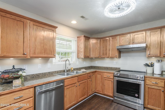 180 Venus St, Holts Summit, MO 65043 - kitchen featuring appliances with stainless steel finishes, under cabinet range hood, a sink, dark wood-type flooring, and recessed lighting