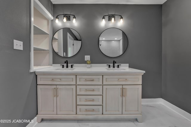 160 Ravenwood Dr, Camdenton, MO 65020 - bathroom featuring double vanity, baseboards, and a sink