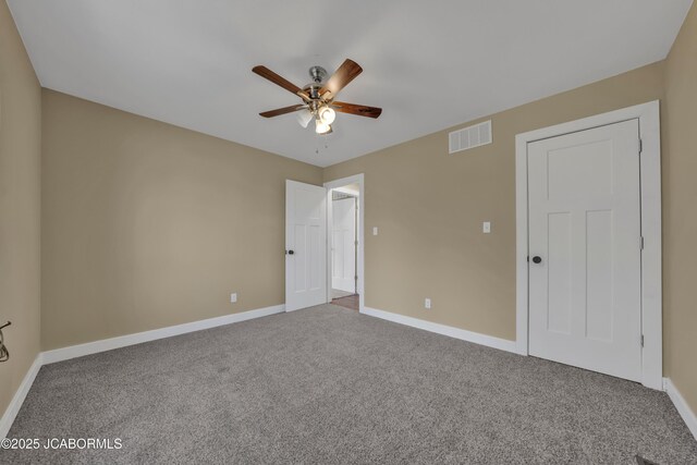 160 Ravenwood Dr, Camdenton, MO 65020 - unfurnished bedroom featuring visible vents, ceiling fan, baseboards, and carpet