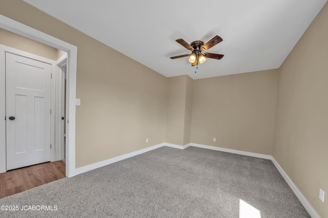 160 Ravenwood Dr, Camdenton, MO 65020 - unfurnished room with baseboards, carpet floors, and a ceiling fan